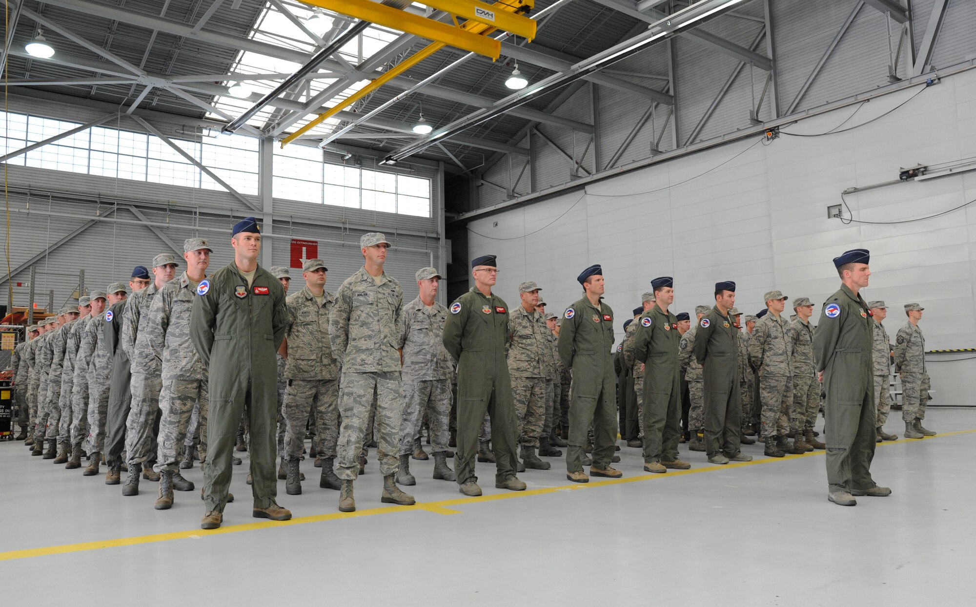 Oregon Air National Guard Airmen from the 123rd Expeditionary Fighter Squadron, 142nd Fighter Wing stand in formation and listen to remarks during their formal demobilization ceremony, Nov. 6, 2015, Portland Air National Guard Base, Ore. (U.S. Air National Guard photo by Tech. Sgt. John Hughel, 142nd Fighter Wing Public Affairs/Released)