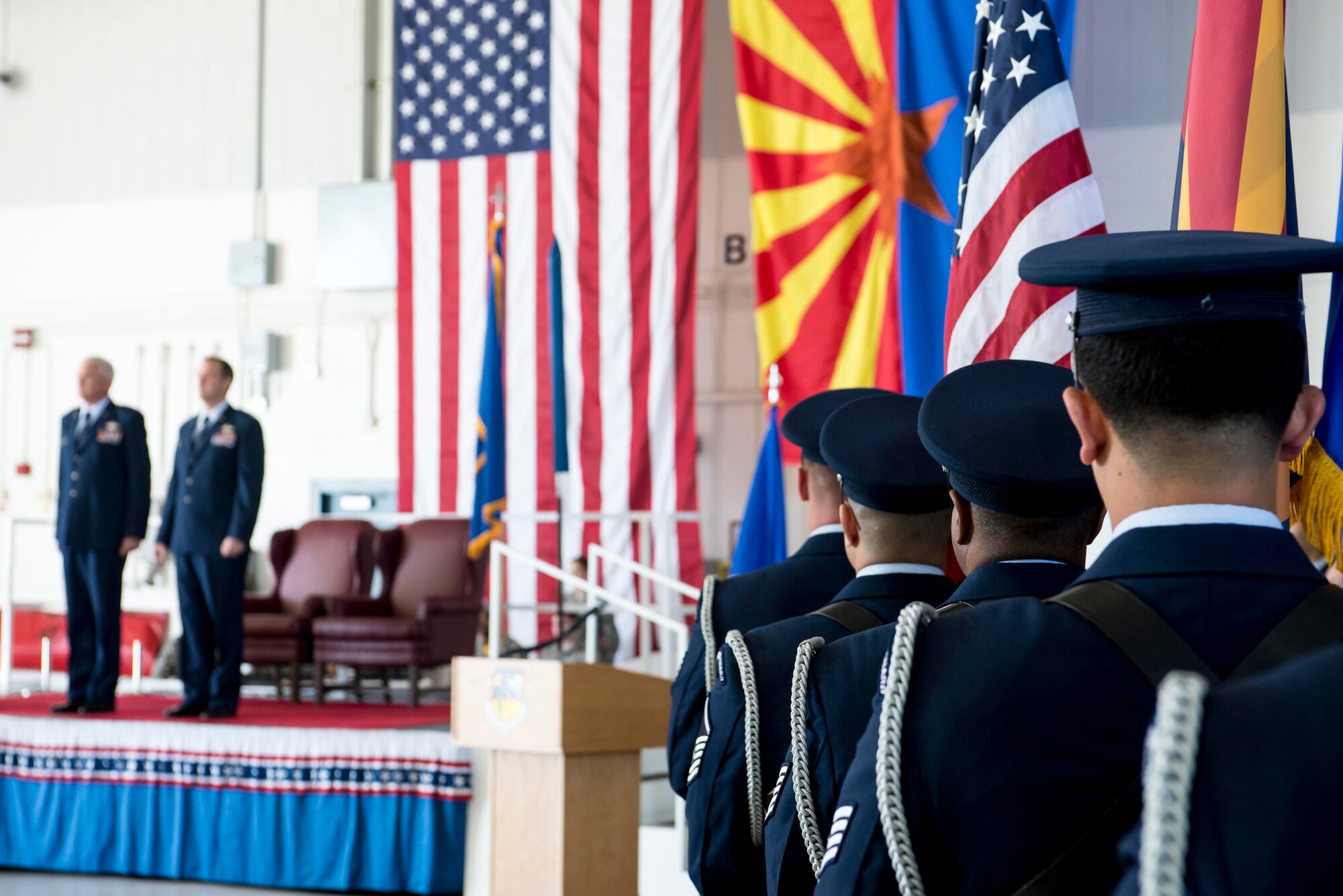 TUCSON, Ariz. -- 162nd Wing honor guard members stand ready to proceed with their ceremonial duties before Brig. Gen. Howard P. Purcell’s promotion Nov. 7 at the Tucson International Airport. Brig. Gen. Edward P. Maxwell, commander of the Arizona Air National Guard, far left, stands next to Purcell before the start of the ceremony. Maxwell officiated the ceremony, and noted Purcell’s promotion was “well-deserved.” (U.S. Air National Guard photo by Tech. Sgt. Hollie A. Hansen /Released)