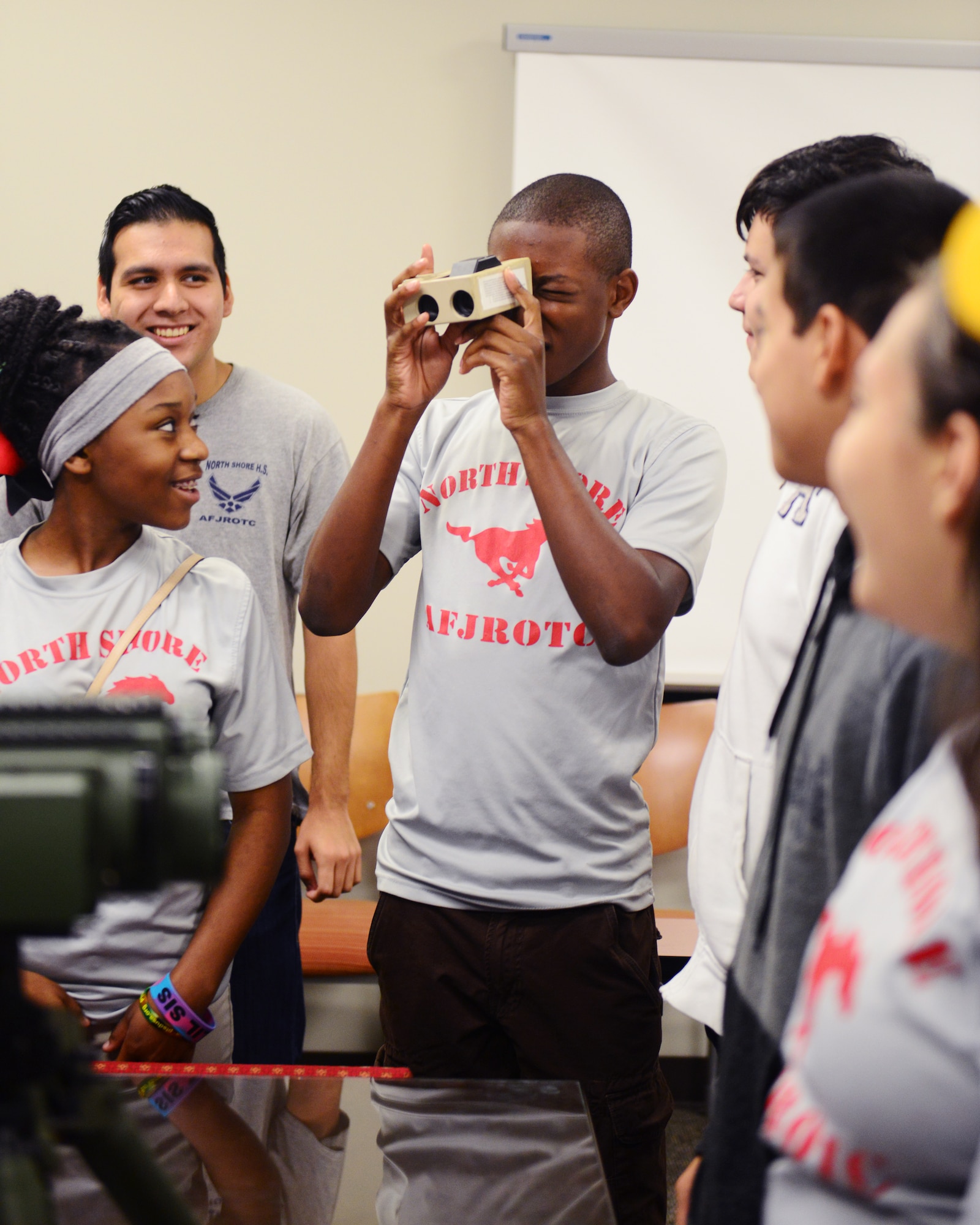 North Shore High School Air Force Junior Reserve Officer Training Corps cadets toured the 147th Reconnaissance Wing at Ellington Field in Houston November 7, 2015. The cadets stopped at the Air Support Operations Squadron to speak with Tactical Air Control Party members and Joint Terminal Attack Controllers about their job as well as the wing's hangar to learn about the MQ-1 Predator.