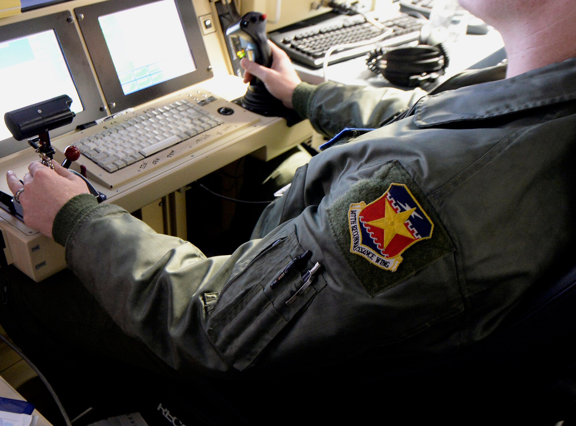 A 147th Reconnaissance Wing, Texas Air National Guard, sensor operator monitors the sensor of an MQ-1 Predator in Latvian airspace Sept. 1, 2015, at Lielvarde Air Base, Latvia. The flight marked the first launch and recover of a large-scale remotely piloted aircraft in Latvia. (Air National Guard photo by 1st Lt. Alicia Lacy)