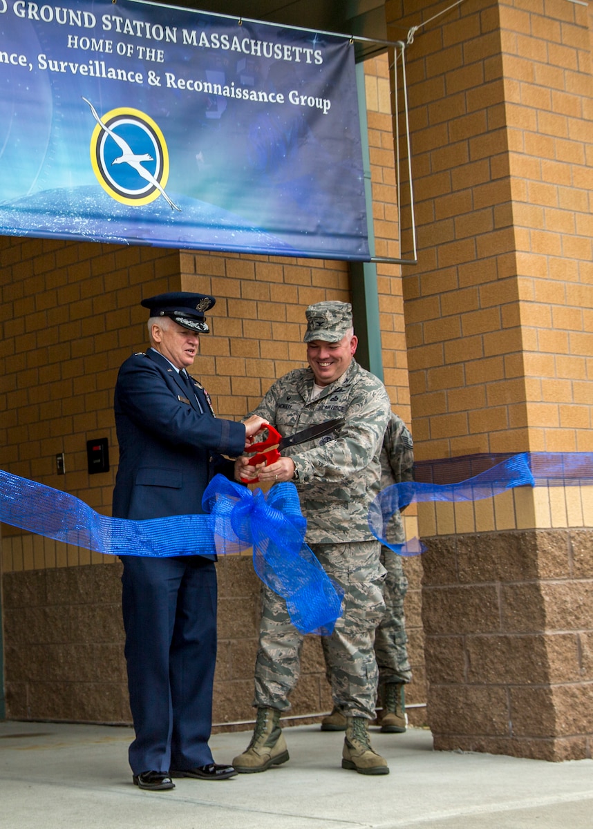 Maj. Gen. Scott L. Rice, The Adjutant General, Massachusetts National Guard, and Col. David McNulty, 102 Intelligence Group commander, cut the ribbon at a ribbon-cutting ceremony November 7, 2015 at Otis Air National Guard Base, Massachusetts. The 102nd opened a state-of-the-art intelligence facility as part of its weapon system, the Distributed Common Ground Station. The DCGS has been a part of the the Intelligence, Surveillance, and Reconnaissance mission of the 102nd since December 2009. (Air National Guard photo by Staff Sgt. Jeremy Bowcock)