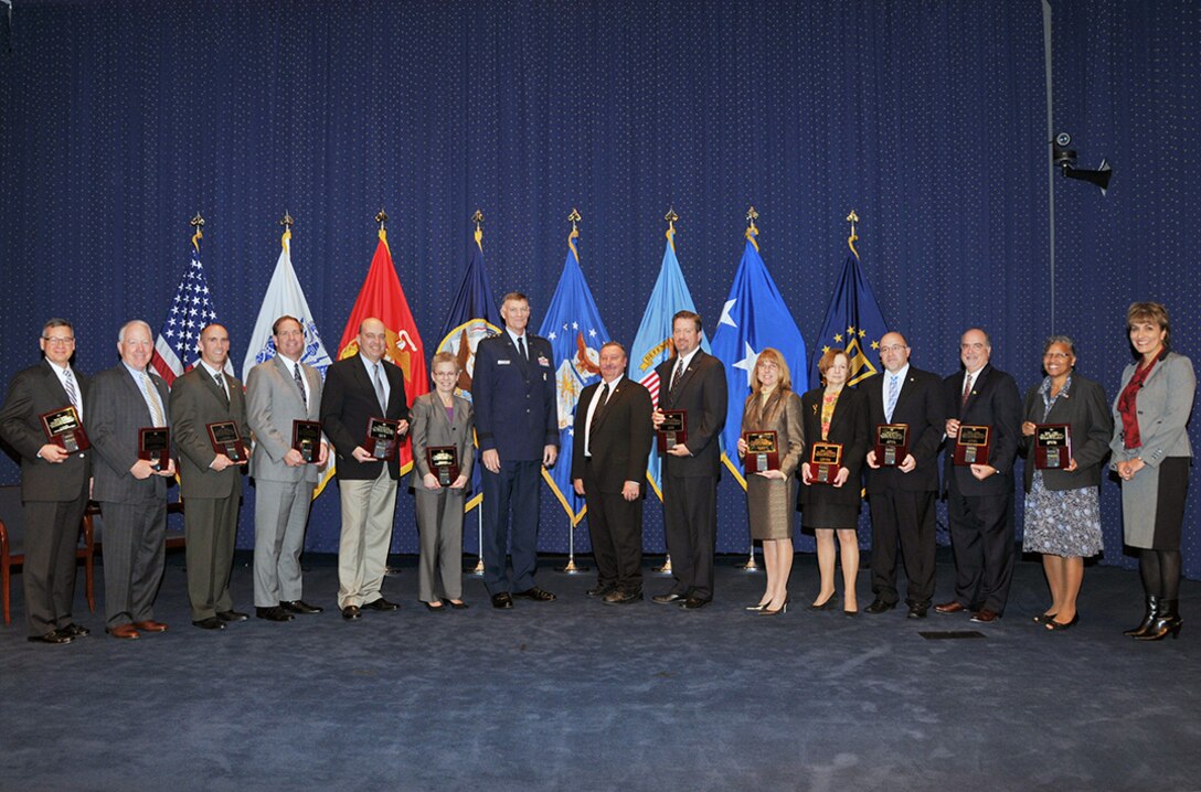 Defense Logistics Agency senior leaders and business process cycle team leads pose for a group photo at the Audit Readiness Assertion Ceremony Oct. 30 at the McNamara Headquarters Complex.