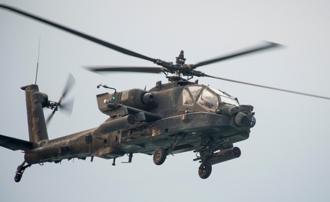 A U.S. AH-64D Apache helicopter provides aerial security during a bilateral exercise with Kuwait naval forces in the Arabian Gulf, Nov. 3, 2015. U.S. Navy photo by Petty Officer 2nd Class Torrey W. Lee