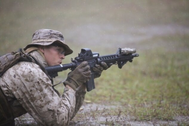 A Marine with 2nd Reconnaissance Battalion finishes a standing-to-prone drill during Expeditionary Operations Training Group’s close quarters tactics course at Camp Lejeune, N.C., Nov. 3, 2015. The course had a series of different ranges and drills they were required to master. They spent time becoming more efficient with the pistol and M4 carbine assault rifle, perfecting the ability to speed reload or change weapons. (U.S. Marine Corps photo by Lance Cpl. Miranda Faughn/Released)