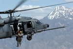 A Utah Army National Guard Soldier from the 19th Special Forces is hoisted up to an HH-60 Pave Hawk helicopter during a combat search and rescue integration exercise over the Utah Test and Training Range in Sandy, Utah, on May 3, 2007. Alaska National Guard rescuers use similar craft in their missions, which resulted in a save of two fliers on Nov. 7, 2015.