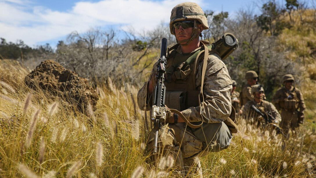 Marines with Kilo Company, 3rd Battalion, 3rd Marine Regiment, pause while patrolling during training exercise Lava Viper, a staple of their pre-deployment training, at Range 10 at Pohakuloa Training Area, Hawaii, Nov. 4, 2015. The purpose of the training was to provide Marines within the company with an opportunity to utilize various tactics and weapons while organizing within the platoons to accomplish a common mission. Lava Viper provides the Hawaii-based Marines with an opportunity to conduct various movements, live-fire and tactical training before departing for Integrated Training Exercise aboard Marine Air-Ground Combat Center Twentynine Palms, Calif., where the battalion will train and be evaluated as a whole.