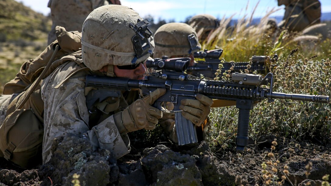 Marines with Kilo Company, 3rd Battalion, 3rd Marine Regiment, provide cover fire for Marines charging a hill during training exercise Lava Viper, a staple of their pre-deployment training, at Range 10 at Pohakuloa Training Area, Hawaii, Nov. 4, 2015. The purpose of the training was to provide Marines within the company with an opportunity to utilize various tactics and weapons while organizing within the platoons to accomplish a common mission. Lava Viper provides the Hawaii-based Marines with an opportunity to conduct various movements, live-fire and tactical training before departing for Integrated Training Exercise aboard Marine Air-Ground Combat Center Twentynine Palms, Calif., where the battalion will train and be evaluated as a whole.