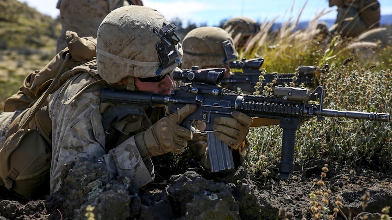 Marines with Kilo Company, 3rd Battalion, 3rd Marine Regiment, provide cover fire for Marines charging a hill during training exercise Lava Viper, a staple of their pre-deployment training, at Range 10 at Pohakuloa Training Area, Hawaii, Nov. 4, 2015. The purpose of the training was to provide Marines within the company with an opportunity to utilize various tactics and weapons while organizing within the platoons to accomplish a common mission. Lava Viper provides the Hawaii-based Marines with an opportunity to conduct various movements, live-fire and tactical training before departing for Integrated Training Exercise aboard Marine Air-Ground Combat Center Twentynine Palms, Calif., where the battalion will train and be evaluated as a whole.