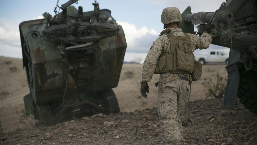 Corporal Herbert Creecy IV, a motor transport maintenance Marine with Transportation Services Company, Combat Logistics Battalion 2, prepares to load a staged wrecked vehicle during a live-fire exercise as part of Integrated Training Exercise 1-16 at Marine Air Ground Combat Center Twentynine Palms, Calif., Nov. 4, 2015.  During ITX, Marines demonstrate core essential tasks and conduct offensive and defensive stability operations.  