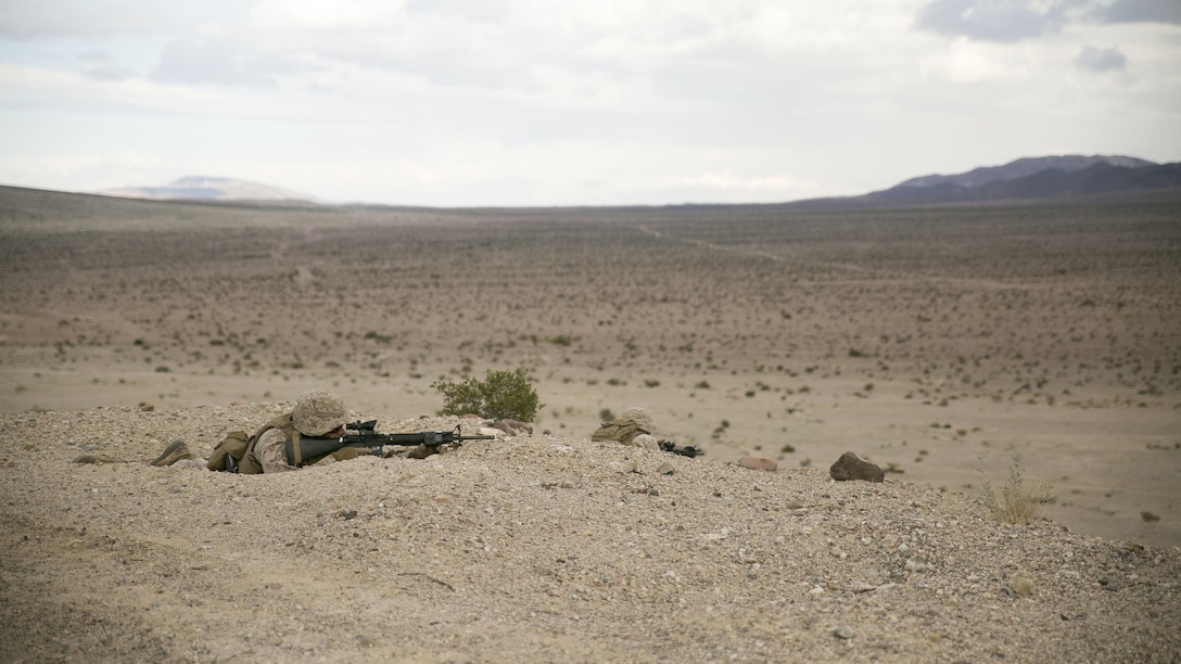 Marines with Charlie Company, 2nd Law Enforcement Battalion, provide security during a live-fire vehicle recovery exercise as part of Integrated Training Exercise 1-16 at Marine Air Ground Combat Center Twentynine Palms, Calif., Nov. 4, 2015. The Marines of 2nd LEB are embedded with Transportation Services Company, Combat Logistics Battalion 2, to provide security during the exercise, allowing the wrecker team to focus on the mission. 