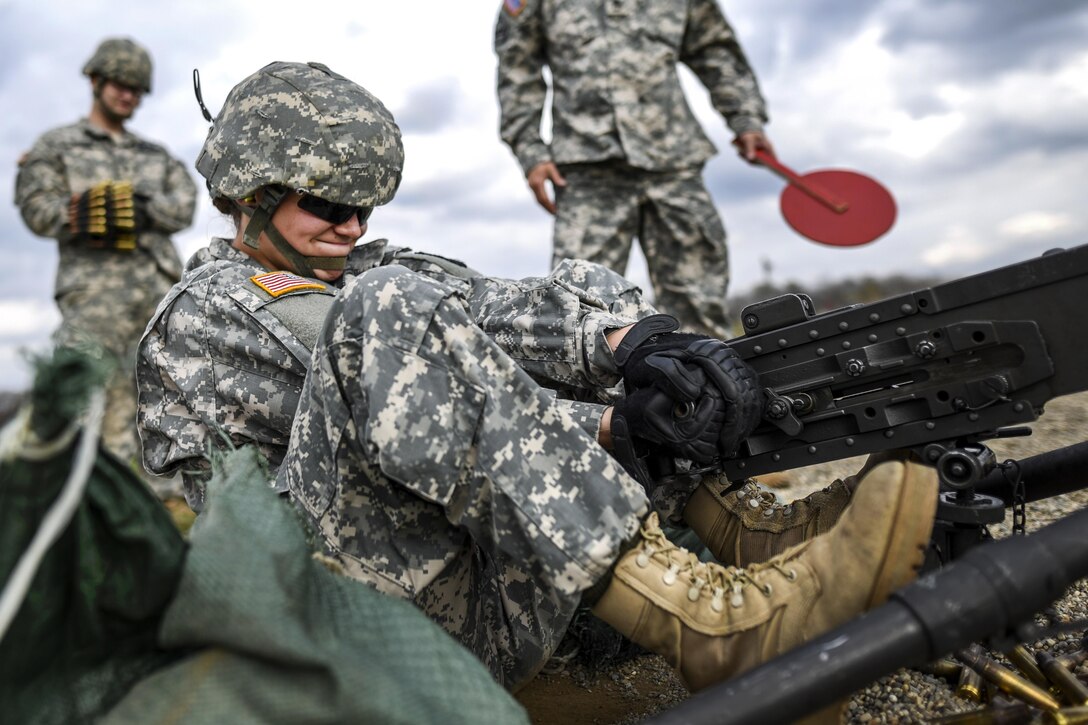 Army Cpl. Brittany Montana pulls the charging handle of a .50-caliber machine gun during training on Camp Atterbury, Ind., Nov. 5, 2015. Montana is a Reservist assigned to the 354th Military Police Company. U.S. Army photo by Master Sgt. Michel Sauret