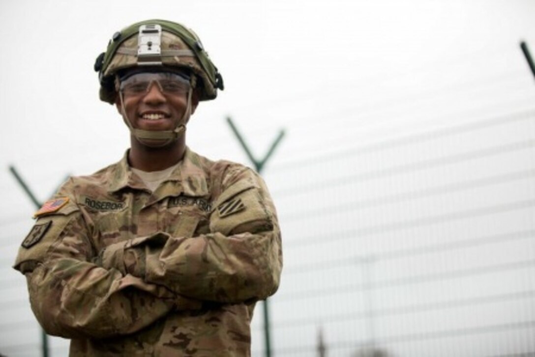 Soldiers serving in Germany discuss values, service, and sacrifice as Veterans Day, observed Nov. 11, approaches. Here, Army Sgt. Charles Roseboro prepares to perform preventive maintenance checks and services with his comrade during Exercise Combined Resolve V at the Joint Multinational Readiness Center in Hohenfels, Germany, Nov. 7, 2015. Courtesy photo