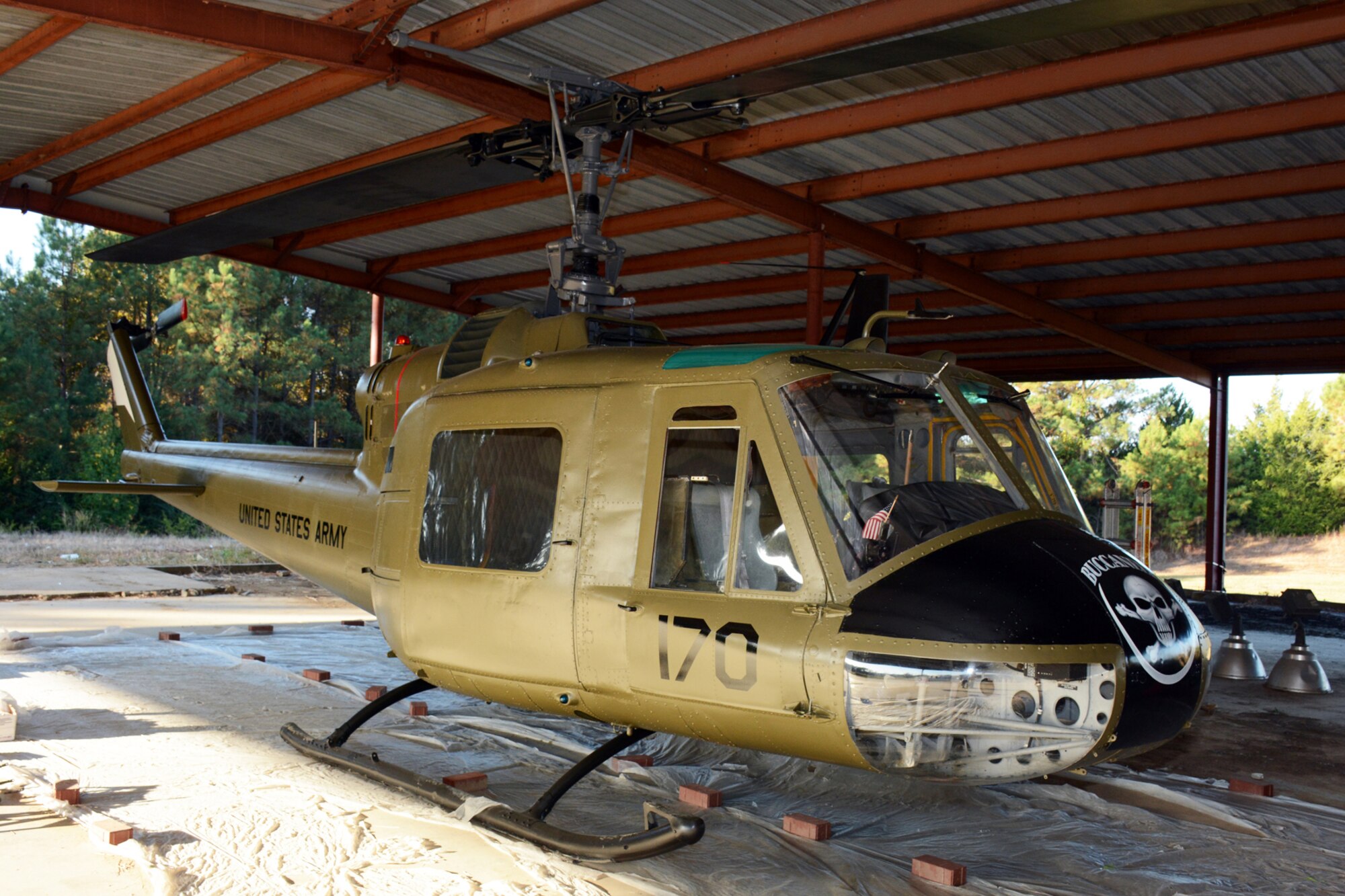 A Bell UH-1C Iroquois helicopter awaits its final decals as part of a restoration project taking place at the Jacksonville Recycling Center in Jacksonville, Ark., Oct. 22, 2015. A group of U.S. Air Force Airmen helped restore the Vietnam era chopper for the Jacksonville Museum of Military History. (U.S. Air Force photo by Master Sgt. Jeff Walston/Released) 
