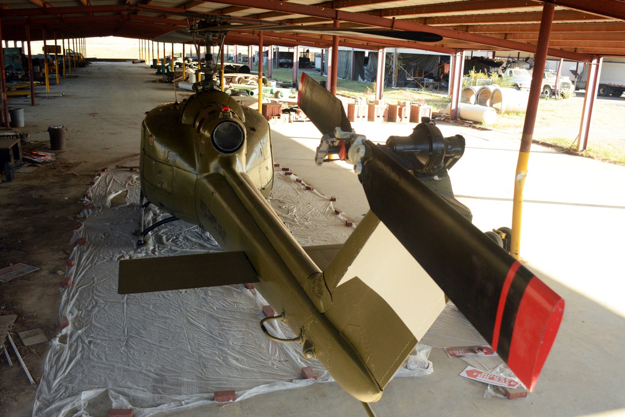 A Bell UH-1C Iroquois helicopter awaits its final decals as part of a restoration project taking place at the Jacksonville Recycling Center in Jacksonville, Ark., Oct. 22, 2015. A group of U.S. Air Force Airmen helped restore the Vietnam era chopper for the Jacksonville Museum of Military History. (U.S. Air Force photo by Master Sgt. Jeff Walston/Released) 