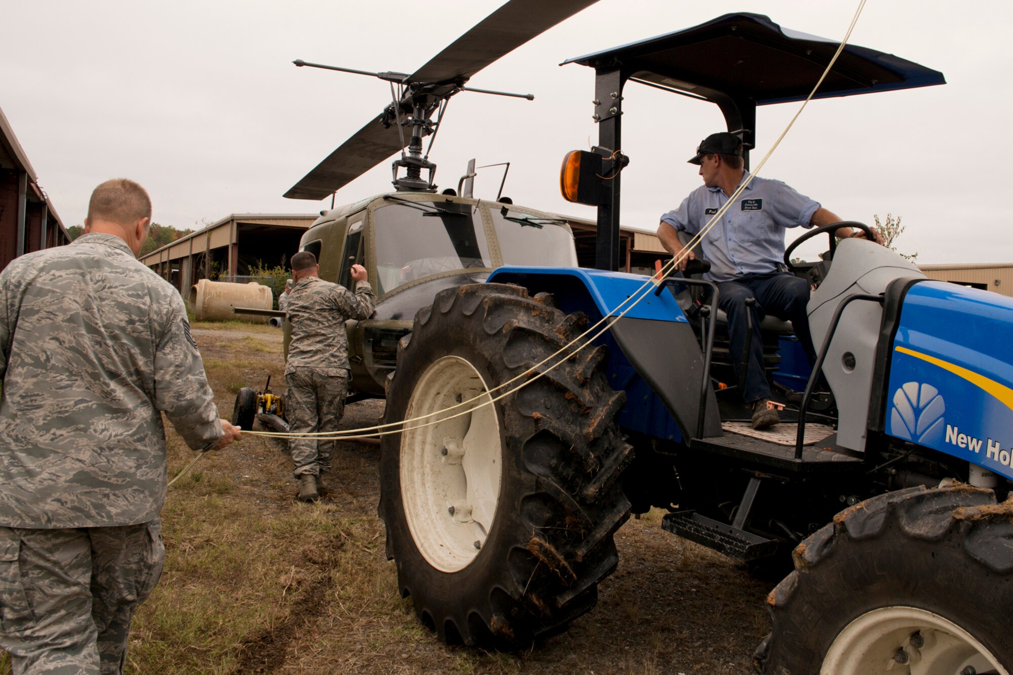 U.S. Air Force Airmen move a newly restored Vietnam era Bell UH-1C Iroquois helicopter to a staging area at the city recycling center in Jacksonville, Ark., Nov. 3, 2015. The helicopter was returned to the Jacksonville Museum of Military History for display the next day. (U.S. Air Force photo by Master Sgt. Jeff Walston/Released)