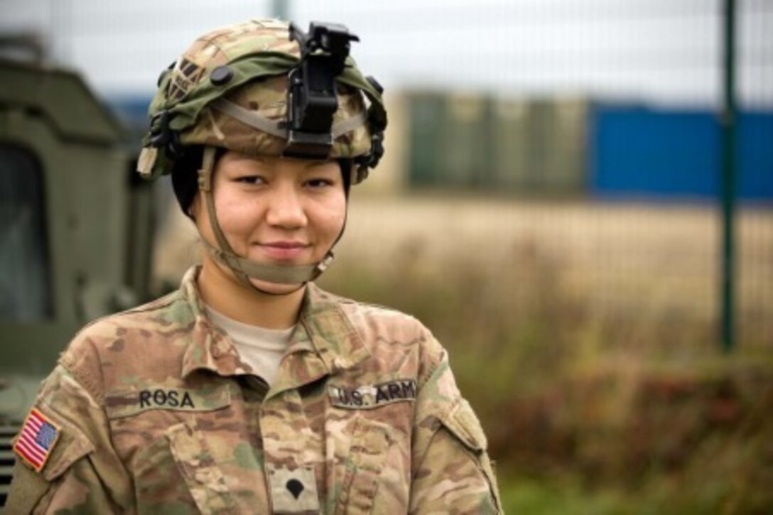 Soldiers serving in Germany discuss values, service, and sacrifice as Veterans Day, observed Nov. 11, approaches. Here, Army Spc. Judy Mera Rosa prepares to perform preventive maintenance checks and services with her comrade Sgt. Charles Roseboro during Exercise Combined Resolve V at the Joint Multinational Readiness Center in Hohenfels, Germany, Nov. 7, 2015. Courtesy photo