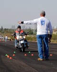 An Arizona National Guard member receives directions while being evaluated during the safe maneuvering portion of a motorcycle safety stand down day here, Dec. 1, 2011. The four-hour course consisted of classroom instruction on accident statistics, awareness of proper use of personal protective equipment, and safe riding techniques.