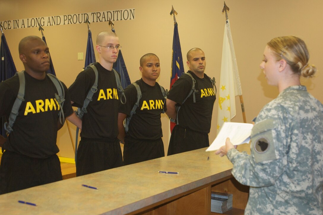 Spc. Emily Clark from from A Company, 2/319th, 3rd BDE 104th Inf. Div., provides support to the 120th AG battalion during annual training with providing instruction to initial entry soldiers on completing necessary forms for in-processing at Fort Jackson, Aug. 7, 2015. (U.S. Army photo by Maj. Satomi Mack-Martin/Released)