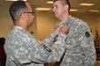Maj. Gen. A.C. Roper, commander 80th Training Command, awards the Army Commendation Medal to Maj. David Porter, 102nd Training Division, for winning the 80th TC Instructor of the Year Award, during a ceremony at Fort Knox, Ky., Nov. 7, 2015.