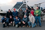 Army Soldiers, assigned to the Warrior Transition Battalion on Joint Base Lewis-McChord, Wash., stand with civilians - most of whom are military veterans - Dec. 3, 2011, after a sturgeon fishing trip on the Columbia River. The trip was initiated by the Wounded Veterans Fishing Program, a non-profit organization started by Danny Gabriel, under which veterans invite Soldiers with JBLM's WTB onto their boats for a Saturday of fishing.