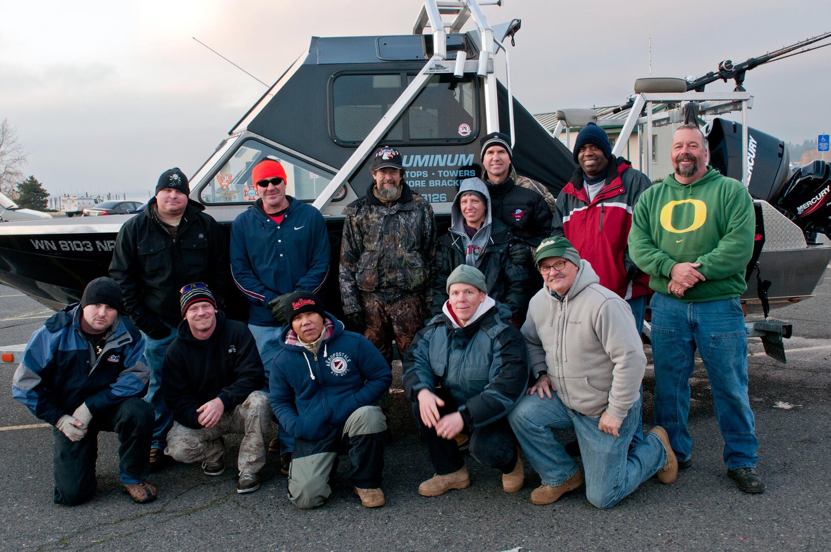 Army Soldiers, assigned to the Warrior Transition Battalion on Joint Base Lewis-McChord, Wash., stand with civilians - most of whom are military veterans - Dec. 3, 2011, after a sturgeon fishing trip on the Columbia River. The trip was initiated by the Wounded Veterans Fishing Program, a non-profit organization started by Danny Gabriel, under which veterans invite Soldiers with JBLM's WTB onto their boats for a Saturday of fishing.