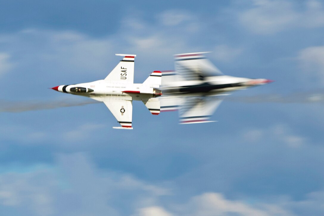 Two F-16 Fighting Falcons perform a knife edge pass during Thunder Over South Georgia on Moody Air Force Base, Ga., Nov. 7, 2015. The F-16s are part of the U.S. Air Force Thunderbirds demonstration team which was the highlight of the open house. U.S. Air Force photo by Tech. Sgt. Zachary Wolf