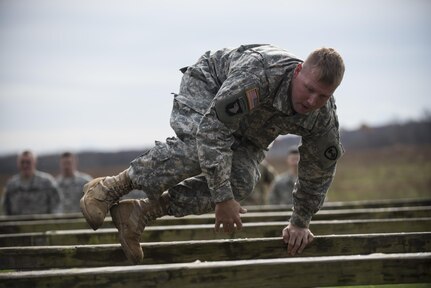 U.S. Army Reserve Soldiers from military police and drill sergeant units tackle a confidence course during a multi-day training event at Camp Atterbury, Ind., Nov. 6. The 384th Military Police Battalion, headquartered at Fort Wayne, Ind., organized a three-day range and field training exercies involving more than 550 U.S. Army Reserve Soldiers and incorporated eight different weapons systems, combat patrolling and a rifle marksmanship competition at Camp Atterbury, Ind., Nov. 5-7. (U.S. Army photo by Master Sgt. Michel Sauret)