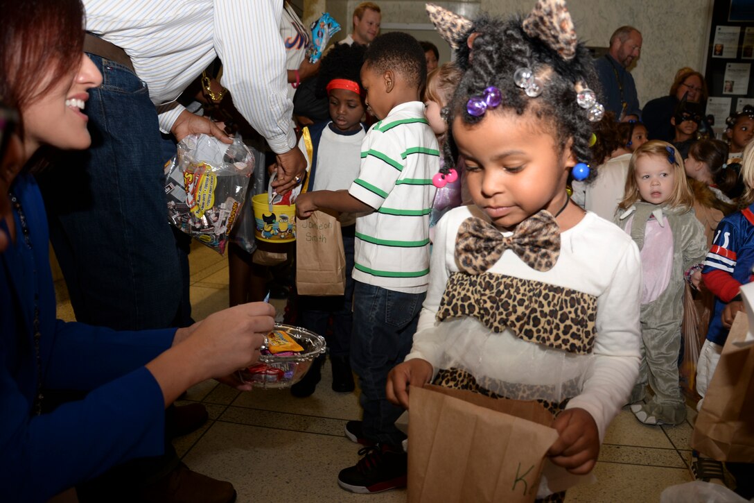 LRD employees pass out candy to children in the John Weld Peck Federal Building.