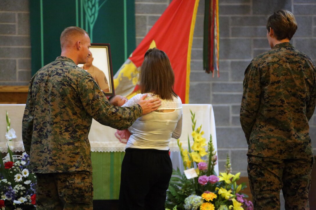 Marines and family members gathered at a chapel with heavy hearts to honor the memory of fallen Staff Sgt. Denver Sugano during a memorial service at Marine Corps Air Station New River, N.C., Nov. 4, 2015. Sugano faithfully served in the Marine Corps for 13 years, primarily serving as a flight equipment technician and a Marine recruiter. Sugano participated in three Unit Deployment Programs, assisted with Hurricane Sandy relief efforts and deploying in support of the 26th Marine Expeditionary Unit. Family, friends and fellow Marines remember Sugano for his dedication to his beloved Corps and his family. (U.S. Marine Corps photo by Cpl. N.W. Huertas/Released)