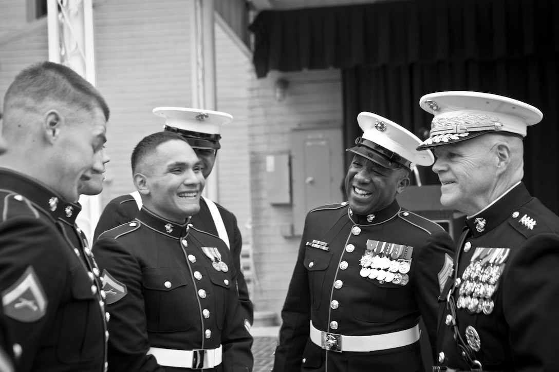 The 37th Commandant of the Marine Corps, Gen. Robert B. Neller, and the 18th Sergeant Major of the Marine Corps, Ronald L. Green, greet Marines following the conclusion of the Pentagon Cake Cutting Ceremony hosted by the Commandant of the Marine Corps, Arlington, VA, Nov. 9, 2015.  The ceremony was held in honor of the 240th Birthday of the United States Marine Corps. (U.S. Marine Corps photo by Sgt. Melissa Marnell, Office of the 18th Sergeant Major of the Marine Corps/Released)