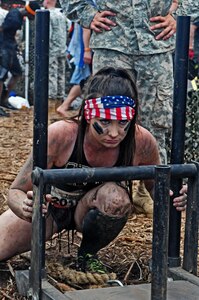 Ashley Hayes, a Tough Mudder competitor, participated in the Army Fitness Challenge after she completed the Central Florida Tough Mudder in Palm Bay, Fla., Nov. 7. For the fitness challenge, Hayes had to complete several tasks, which included pushing a weighted sleigh, three pullups, low crawling, 10 declined pushups and then pulling the weighted sleigh back to the start line.