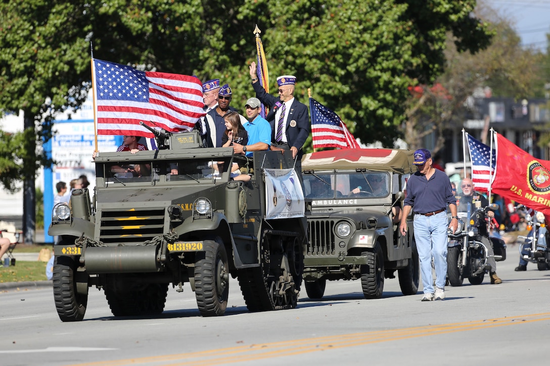 Veterans with the Beirut Memorial Chapter 642 wave from an M3 personnel half-track carrier during the 20th Annual Veterans Day Parade in Jacksonville, N.C., Nov. 7, 2015. U.S. Marine Corps photo by Staff Sgt. Neill A. Sevelius 