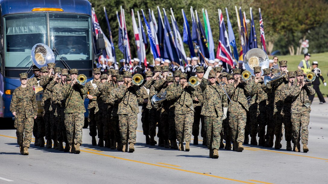 The Second Marine Division Band marches during the 20th Annual Veterans Day Parade in Jacksonville, N.C., Nov. 7, 2015. The Veterans Day parade, hosted by Rolling Thunder, allowed veterans, service members and residents of Jacksonville to show support for members of the armed forces. U.S. Marine Corps photo by Sgt. Christopher Q. Stone