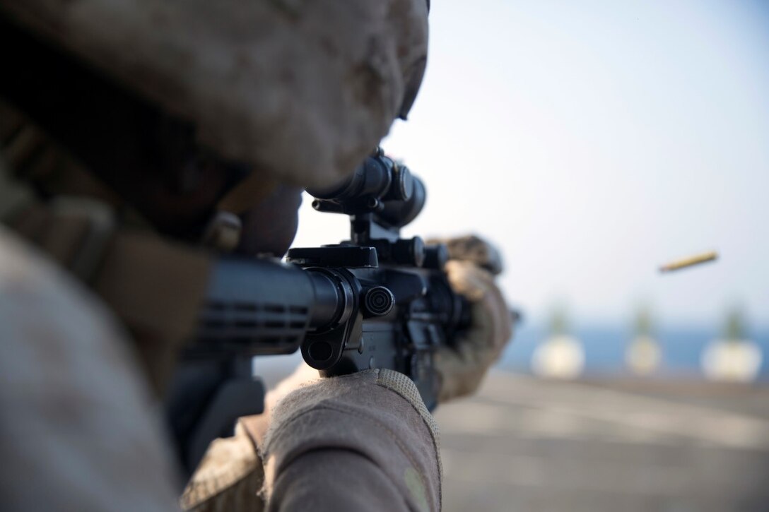 GULF OF ADEN (Oct. 20, 2015) U.S. Marine Lance Cpl. Willy Jackson engages his target during a marksmanship qualification course aboard the USS Rushmore (LSD 47). Jackson is an amphibious assault vehicle crewman with Kilo Company, Battalion Landing Team 3rd Battalion, 1st Marine Regiment, 15th Marine Expeditionary Unit. The marksmanship course focused on retaining basic marksmanship skills which prepares them for potential operations while deployed with the 15th MEU.. (U.S. Marine Corps photo by Sgt. Emmanuel Ramos/Released)