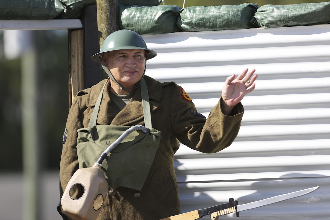 A man wears a World War I era combat uniform and waves from a float during the 20th Annual Veterans Day Parade in Jacksonville, N,C,, Nov. 7, 2015. The parade, hosted by Rolling Thunder, allowed veterans, service members and residents of Jacksonville to show support for members of the armed forces. U.S. Marine Corps photo by Staff Sgt. Neill A. Sevelius