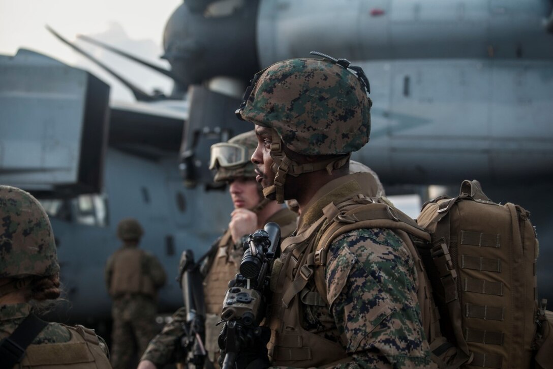 INDIAN OCEAN (Nov. 4, 2015) U.S Marines and Sailors with the 15th Marine Expeditionary Unit wait for directions during a mass-casualty drill on the flight deck of the USS Essex (LHD 2).The Marines and Sailors honed their skills to become quicker and more efficient should a situation arise where medical attention is needed. The 15th MEU is currently deployed in the Indo-Asia-Pacific region to promote regional stability and security in the U.S. 7th Fleet area of operations. (U.S. Marine Corps photo by Cpl. Elize McKelvey/Released)