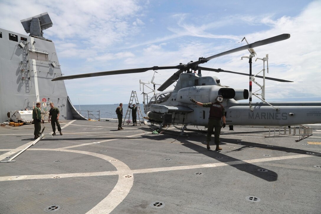 INDIAN OCEAN (Nov. 6, 2015) U.S. Marines with Marine Medium Tiltrotor Squadron 161 (Reinforced), 15th Marine Expeditionary Unit, prepare to fold blades on an AH-1Z Viper aboard the USS Anchorage (LPD 23). The 15th MEU is currently deployed in the Indo-Asia-Pacific region to promote regional stability and security in the U.S. 7th Fleet area of operations. (U.S. Marine Corps photo by Sgt. Steve H. Lopez/Released)