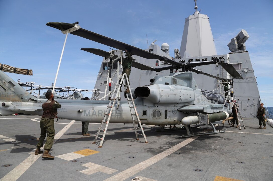 INDIAN OCEAN (Nov. 6, 2015) U.S. Marines with Marine Medium Tiltrotor Squadron 161 (Reinforced), 15th Marine Expeditionary Unit, fold blades on an AH-1Z Viper aboard the USS Anchorage (LPD 23). The 15th MEU is currently deployed in the Indo-Asia-Pacific region to promote regional stability and security in the U.S. 7th Fleet area of operations. (U.S. Marine Corps photo by Sgt. Steve H. Lopez/Released)
