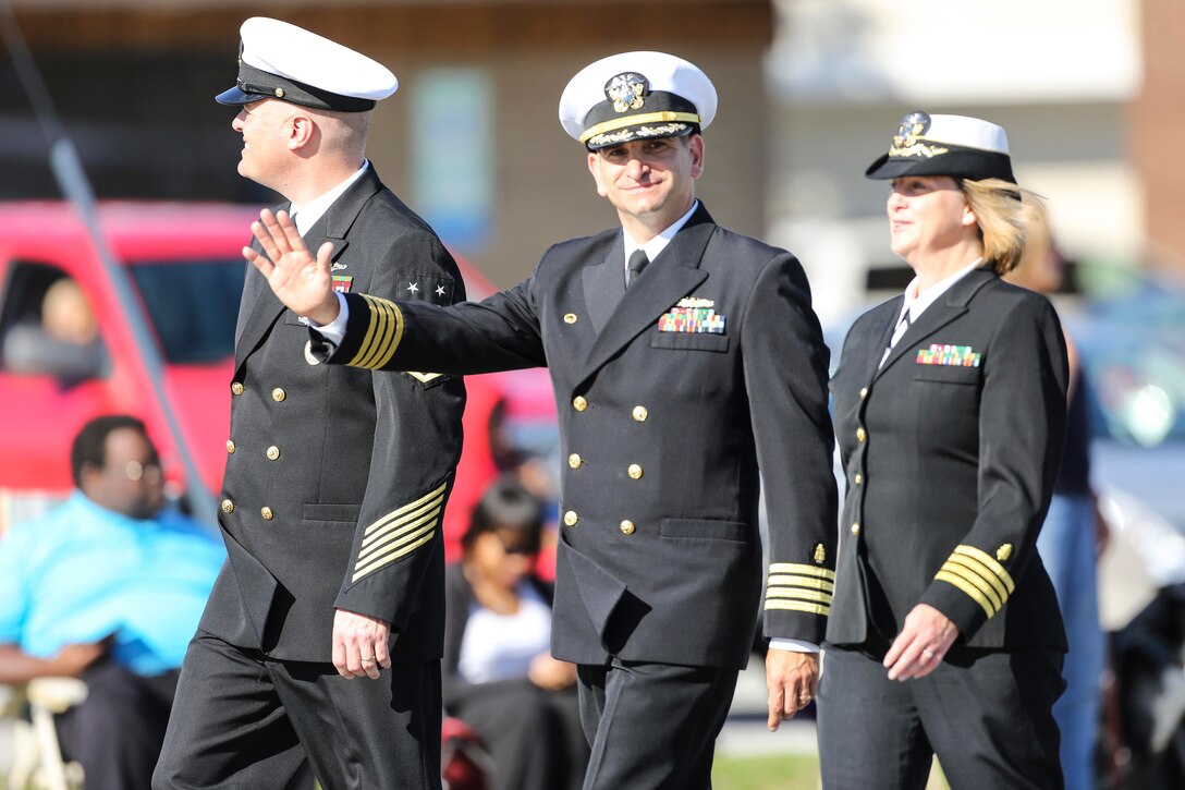 U.S. Navy Capt. Rick Freedman, center, commanding officer of Naval Hospital Camp Lejeune, waves during the 20th Annual Veterans Day Parade in Jacksonville, N.C., Nov. 7, 2015. U.S. Marine Corps photo by Staff Sgt. Neill A. Sevelius