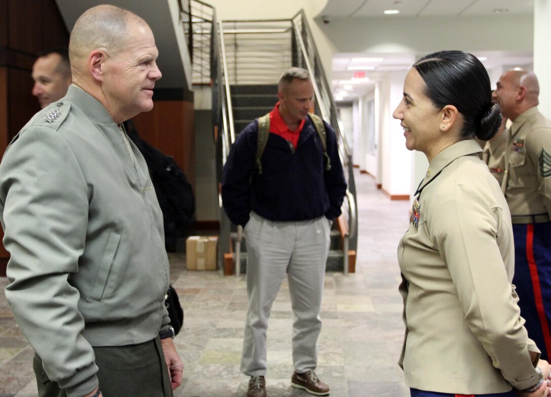 Commandant of the Marine Corps, Gen. Robert B. Neller, speaks with Commanding Officer of Recruiting Station Los Angeles, Maj. Aixa Dones, after he presented the Marines of RS Los Angeles with his challenge coin, Nov. 6, 2015. The commandant flew in to Los Angeles to attend the Reagan National Defense Forum, and upon landing at the Camarillo airport, he recognized the Marines for their hard work and dedication in recruiting efforts. (U.S. Marine Corps photo by Sgt. Alicia R. Leaders/Released)