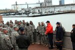 National Guard members of Joint Task Force 71, the command and control for the FEMA Region VI homeland response force, meet with the Coast Guard and emergency response organizations during a tour of the Port of Houston Dec. 6, 2011. JTF-71 participated in the ship channel tour to continue building relationships with the emergency response agencies responsible for protecting the area.