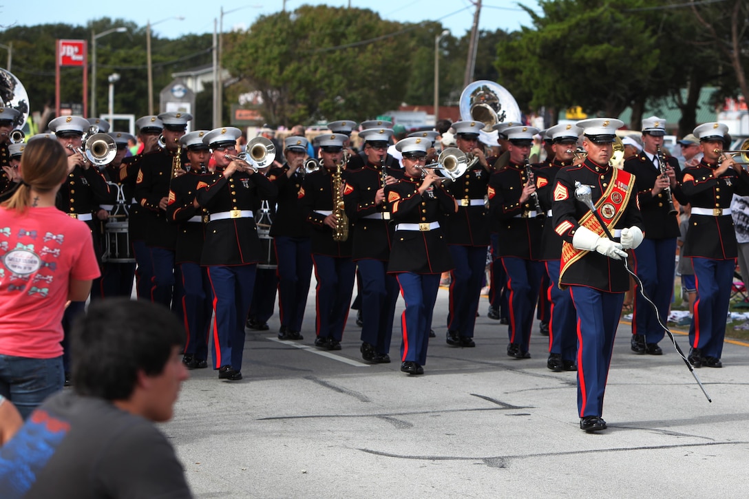 The 2nd Marine Aircraft Wing Band performs for crowds at the 2015 Carteret County Veteran’s Day Parade in Morehead City, N.C., Oct. 7, 2015. The parade was a chance for the public and armed forces to show their appreciation to the veterans and active duty military of Marine Corps Air Station Cherry Point. (U.S. Marine Corps photo by Pfc. Nicholas P. Baird/ Released)