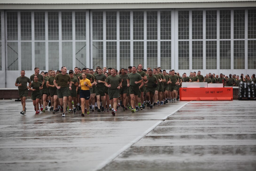 Major Gen. Gary L. Thomas, left, Command Master Chief Beth A. Nilson, center, and Sgt. Maj. Richard D. Thresher lead a formation of Marines across the flight line during the Marine Corps birthday run at Marine Corps Air Station Cherry Point, N.C., Nov. 9, 2015. More than 1,500 Marines and Sailors with 2nd Marine Aircraft Wing and MCAS Cherry Point participated in the motivational run to commemorate the Marine Corps’ 240th birthday. The run is held annually to celebrate the traditions of the Marine Corps and the camaraderie of the service members. Thomas is the commanding general, Nilson is the command master chief and Thresher is the sergeant major of 2nd MAW. (U.S. Marine Corps photo by Cpl. Unique Roberts/ Released)