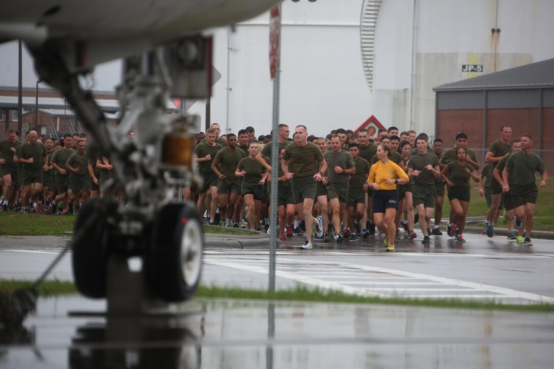 Major Gen. Gary L. Thomas, left, Command Master Chief Beth A. Nilson, center, and Sgt. Maj. Richard D. Thresher lead a formation of Marines during the Marine Corps birthday run at Marine Corps Air Station Cherry Point, N.C., Nov. 9, 2015. More than 1,500 Marines and Sailors with 2nd Marine Aircraft Wing and MCAS Cherry Point participated in the motivational run to commemorate the Marine Corps’ 240th birthday. The run is held annually to celebrate the traditions of the Marine Corps and the camaraderie of the service members. Thomas is the commanding general, Nilson is the command master chief and Thresher is the sergeant major of 2nd MAW. (U.S. Marine Corps photo by Cpl. N.W. Huertas/ Released)