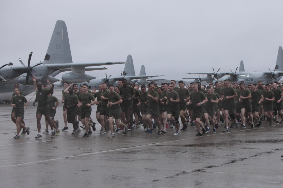 Hundreds of Marines run across the flight line during the Marine Corps birthday run at Marine Corps Air Station Cherry Point, N.C., Nov. 9, 2015. More than 1,500 Marines and Sailors with 2nd Marine Aircraft Wing and MCAS Cherry Point participated in a motivational run to commemorate the Marine Corps’ 240th birthday. The run is held annually to celebrate the traditions of the Marine Corps and the camaraderie of the service members. (U.S. Marine Corps photo by Sgt. Grace L. Waladkewics/ Released)