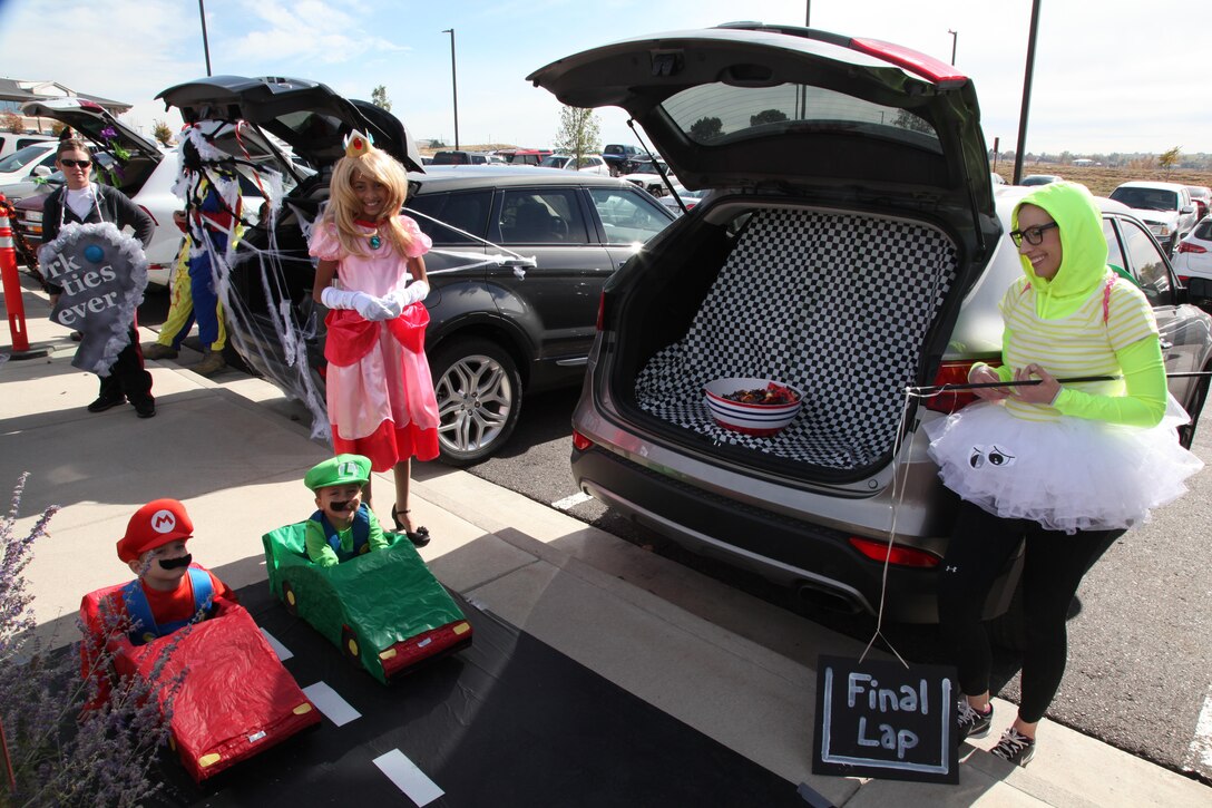 Children of Air Reserve Personnel Center employees packed the parking lot for their share of candy and fruit snacks during ARPC’s first trunk or treat event Oct. 29, 2015, on Buckley Air Force Base, Colo. The ARPC booster club sponsored the event, which drew more than 100 children who got a chance to view Halloween themes from 19 vehicles on display. The event was open to all ARPC employees and their children who began “trunk or treating” after participating vehicles and childrens’ costumes were judged in “Best Trunk”, “Child 10 and Up” and “Child 9 and Under” categories. (U.S. Air Force photo/Quinn Jacobson) 