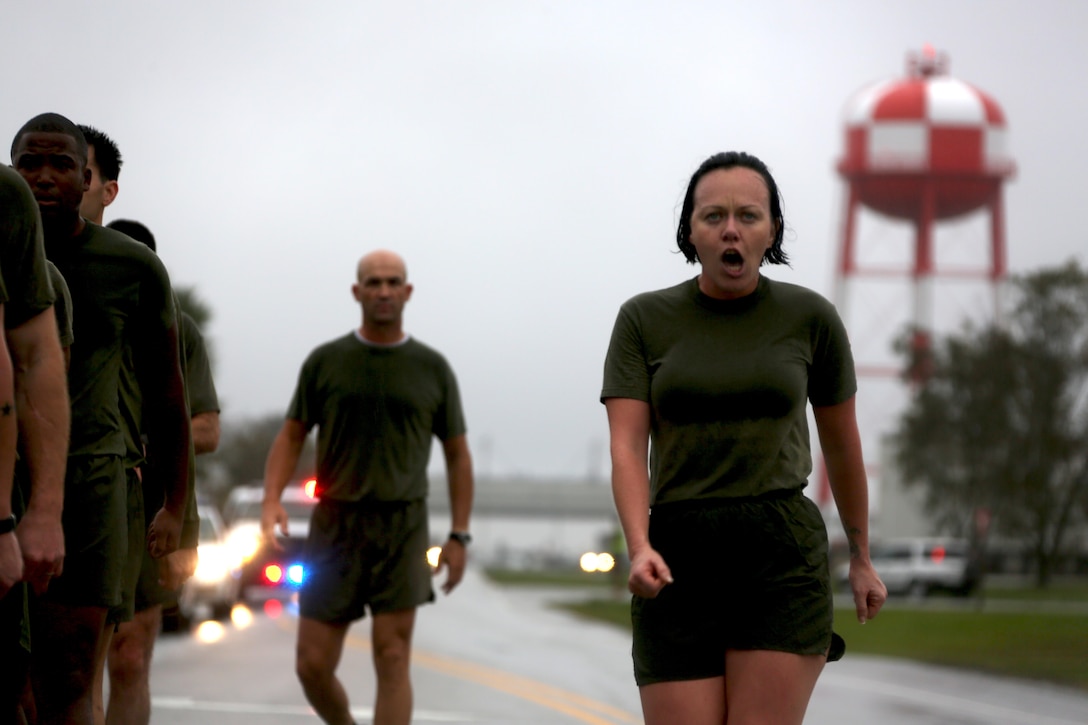 A Marine leads a formation through the streets during the Marine Corps birthday run at Marine Corps Air Station Cherry Point, N.C., Nov. 9, 2015. More than 1,500 Marines and Sailors with 2nd Marine Aircraft Wing and MCAS Cherry Point participated in the motivational run to commemorate the Marine Corps’ 240th birthday. The run is held annually to celebrate the traditions of the Marine Corps and the camaraderie of the service members. (U.S. Marine Corps photo by Cpl. N.W. Huertas/ Released)