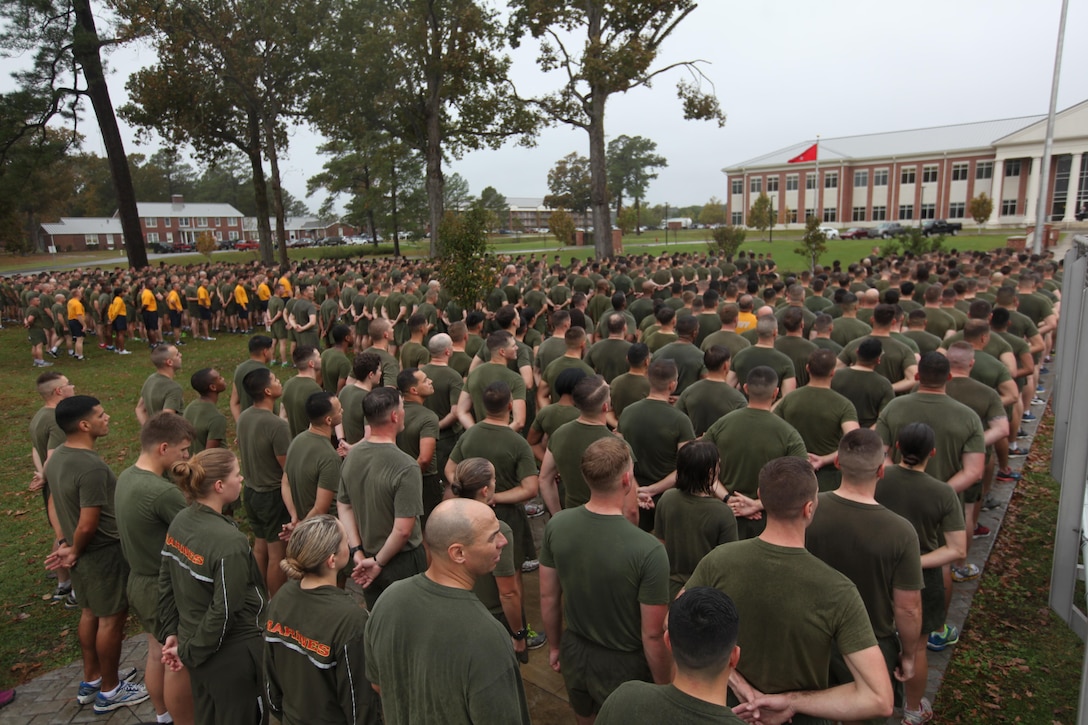 Marines stand at parade rest after a motivational run at Marine Corps Air Station Cherry Point, N.C., Nov. 9, 2015.  More than 1,500 Marines and Sailors with 2nd Marine Aircraft Wing and MCAS Cherry Point participated in the motivational run to commemorate the Marine Corps’ 240th birthday. The run is held annually to celebrate the traditions of the Marine Corps and the camaraderie of the service members. (U.S. Marine Corps photo by Cpl. Unique Roberts/ Released)