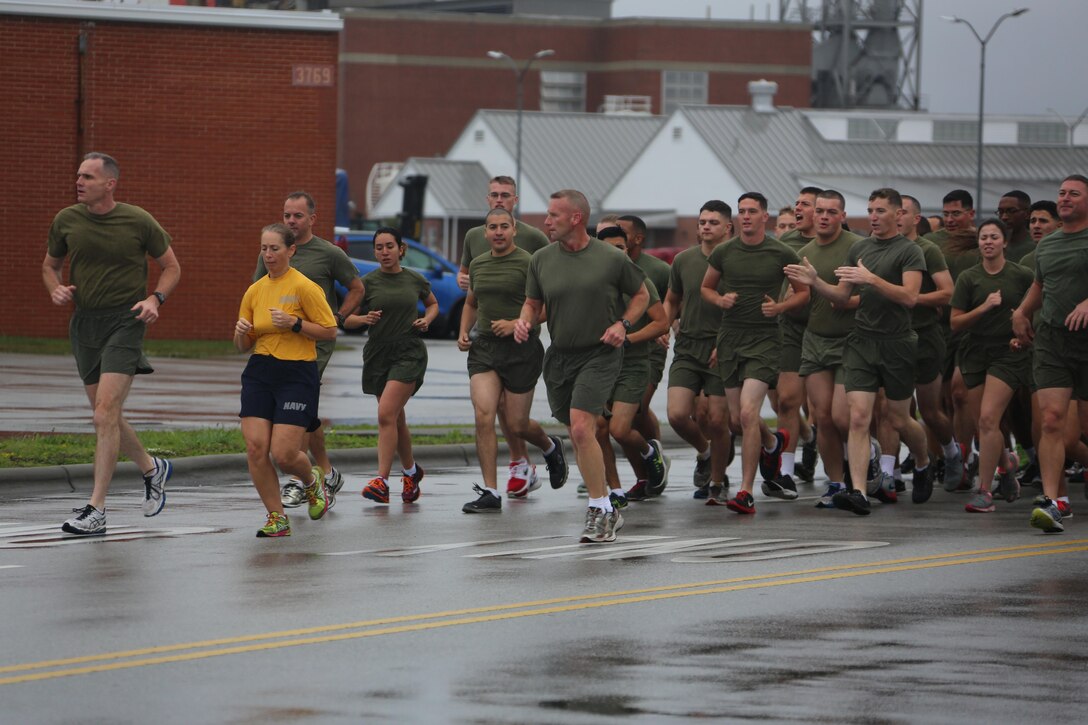 Major Gen. Gary L. Thomas, left, Command Master Chief Beth A. Nilson, center, and Sgt. Maj. Richard D. Thresher lead a formation of Marines during the Marine Corps birthday run at Marine Corps Air Station Cherry Point, N.C., Nov. 9, 2015. More than 1,500 Marines and Sailors with 2nd Marine Aircraft Wing and MCAS Cherry Point participated in the motivational run to commemorate the Marine Corps’ 240th birthday. The run is held annually to celebrate the traditions of the Marine Corps and the camaraderie of the service members. Thomas is the commanding general, Nilson is the command master chief and Thresher is the sergeant major of 2nd MAW. (U.S. Marine Corps photo by Cpl. N.W. Huertas/ Released)