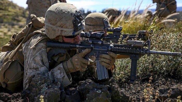 Marines with Kilo Company, 3rd Battalion, 3rd Marine Regiment, provide cover fire for Marines charging a hill during training exercise Lava Viper, a staple of their pre-deployment training, at Range 10 at Pohakuloa Training Area, Hawaii, Nov. 4, 2015. The purpose of the training was to provide Marines within the company with an opportunity to utilize various tactics and weapons while organizing within the platoons to accomplish a common mission. Lava Viper provides the Hawaii-based Marines with an opportunity to conduct various movements, live-fire and tactical training before departing for Integrated Training Exercise aboard Marine Air-Ground Combat Center Twentynine Palms, Calif., where the battalion will train and be evaluated as a whole.